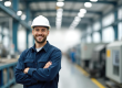 Main standing in front of compressed air system for production.